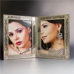Indian silver folding double photograph frame, of rectangular form, with beaded border and...