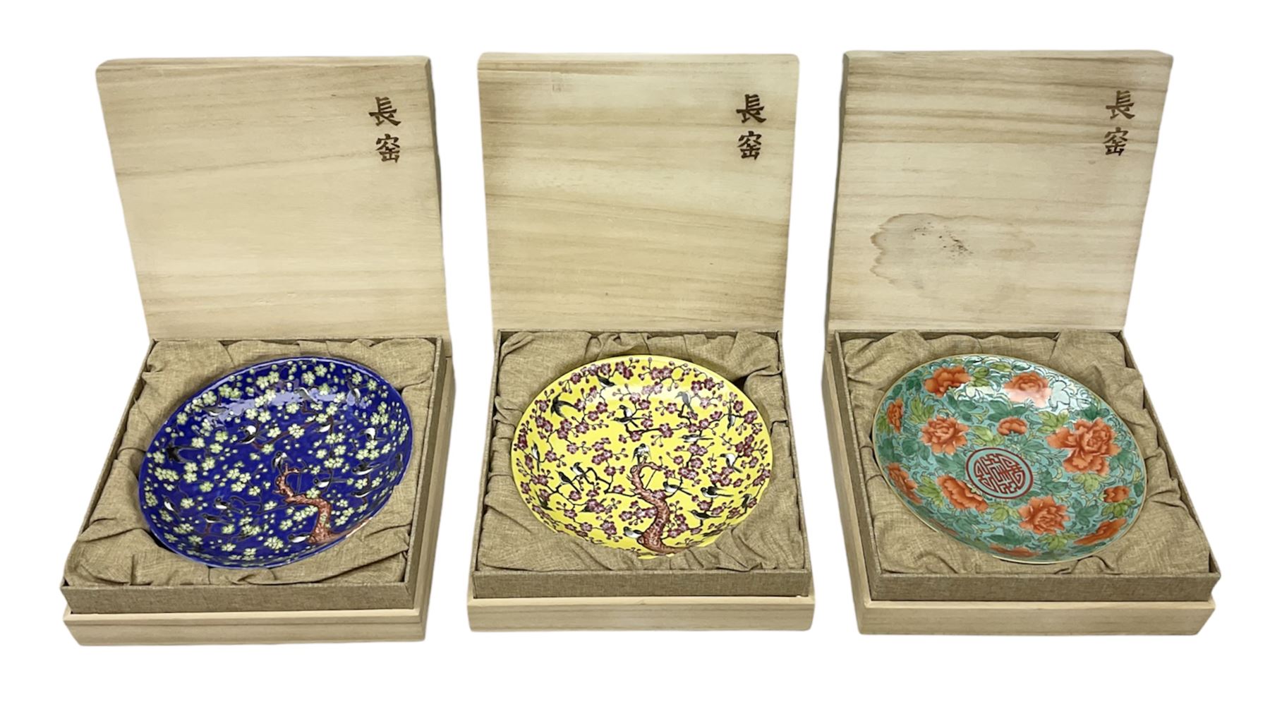 Three Chinese polychrome enamel plates each decorated with floral decoration, all marked beneath, D21cm 