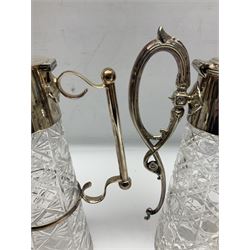 Pair of Mappin and Webb silver plate pierced pedestal bon bon dishes, together with other silver plate comprising teapot stand engraved with lion's head to centre, two cut glass claret jugs, two bottle coasters with acorn decoration, two open salts upon dolphin mounts, tea caddy, three piece cruet set and a large oval tray with pierced sides and upon four ball feet