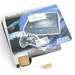 Sega Saturn games console, boxed with two games 'Daytona USA' and 'Sega Rally Championships'