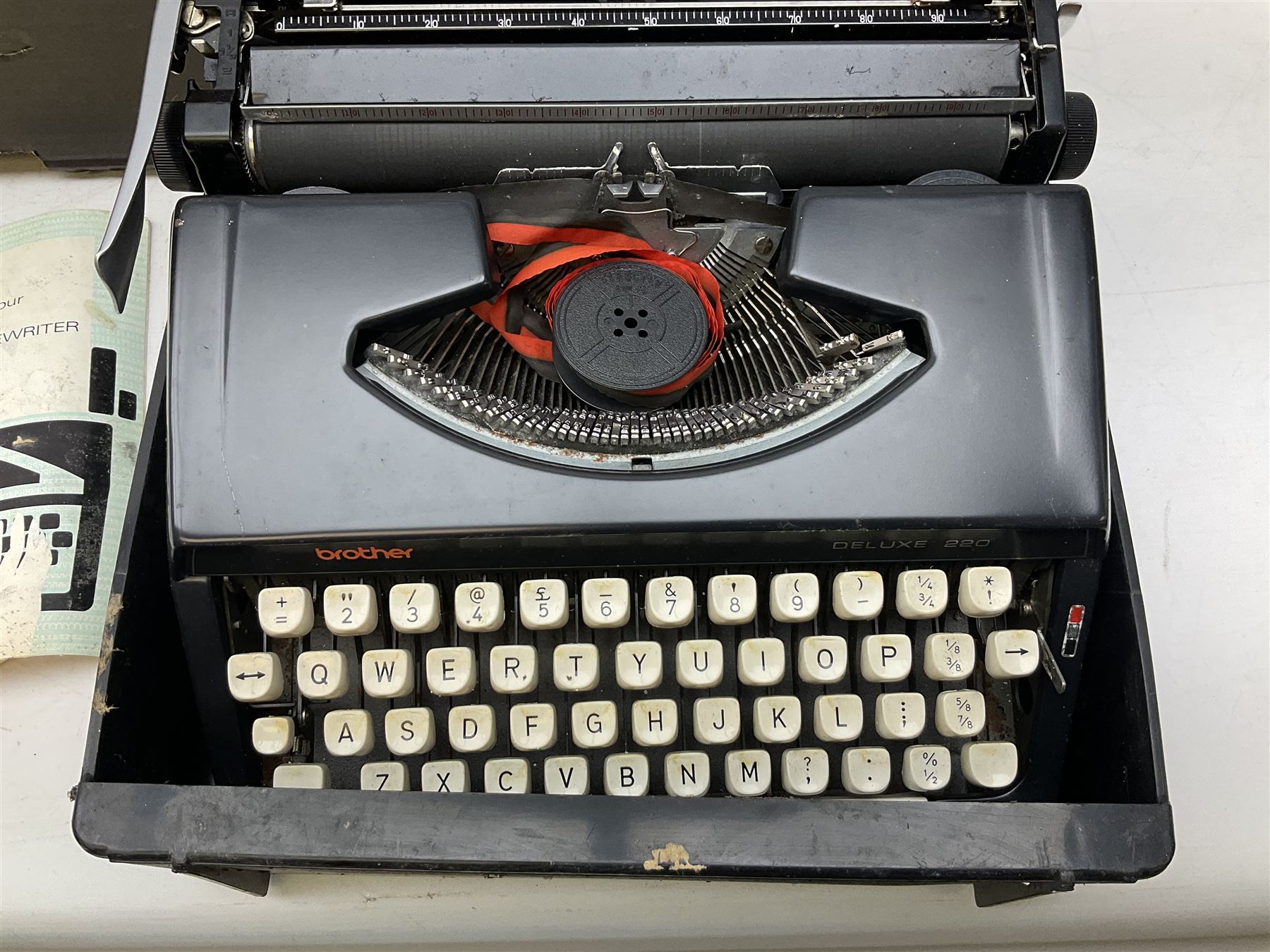 Brother Deluxe 220 manual typewriter with case, together with a large collection of vinyl lp