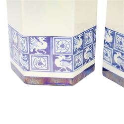 Pair of 1920's Art Deco Royal Doulton lustreware hexagonal vases, with boards of checkerboard design of alternating bird and scroll motifs, designed by Reco Capey, H28cm