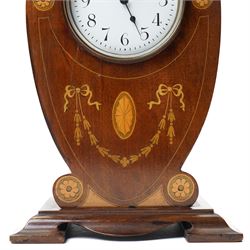 Edwardian- 8-day heart-shaped mahogany bedside table clock with decorative contrasting inlay c1905, white enamel dial with Arabic numerals, minute markers and steel spade hands, French timepiece movement with a later replacement lever platform escapement, wound and set from the rear. With key. 