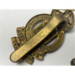 Twenty cap badges including Hertfordshire, Royal Sussex, Cambridgeshire, Hampshire, Notts and Derby, East Surrey, Herefordshire, South Lancashire, Devonshire, Bedfordshire, Durham Light Infantry etc (20)