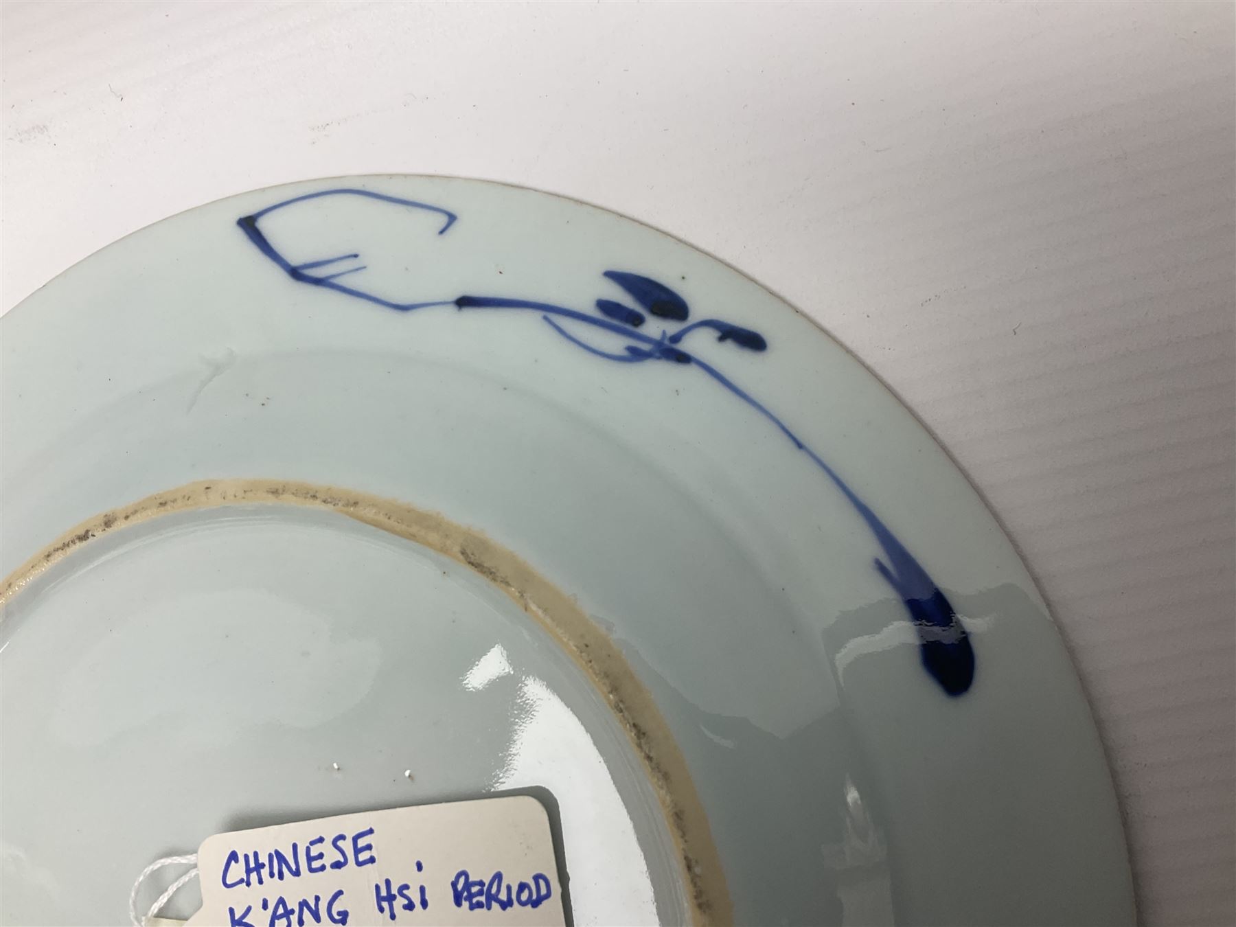 Japanese Meiji period Arita blue and white plate, of circular form, painted with riverside landscape and bird upon flowering branch, with character mark beneath, D24.5cm, together with two 18th century Chinese blue and white plates, each painted with floral design, each approximately D22.5cm