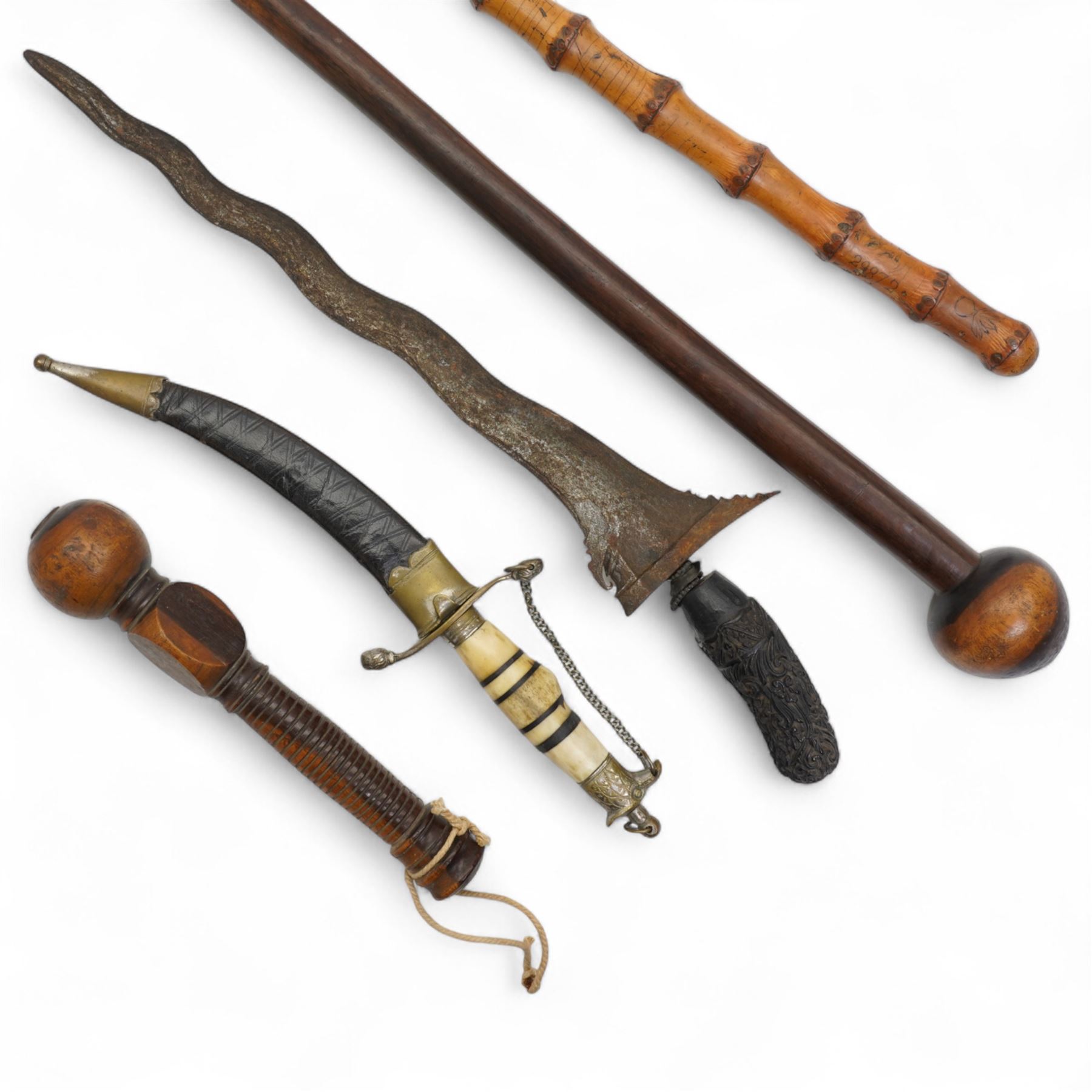 African knobkerrie, Malayan Kris, bamboo stick inscribed T.H.J. 29872, Arabian dagger with engraved curved blade and bone handle and a wooden gavel (4)