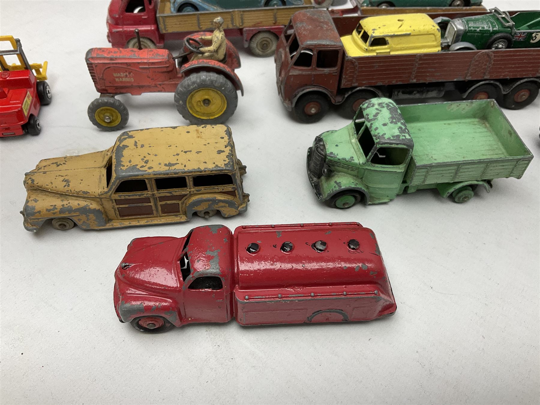 Dinky - sixteen unboxed and playworn die-cast models including Foden lorry, Big Bedford lorry with Halesowen Farm Trailer, Thunderbolt land speed record car, Spirit of the Wind racing car, market garden truck, Bedford tipper, station wagon, tanker, motorcycle combination etc; two Corgi models; and five Matchbox/Lesney models (23)
