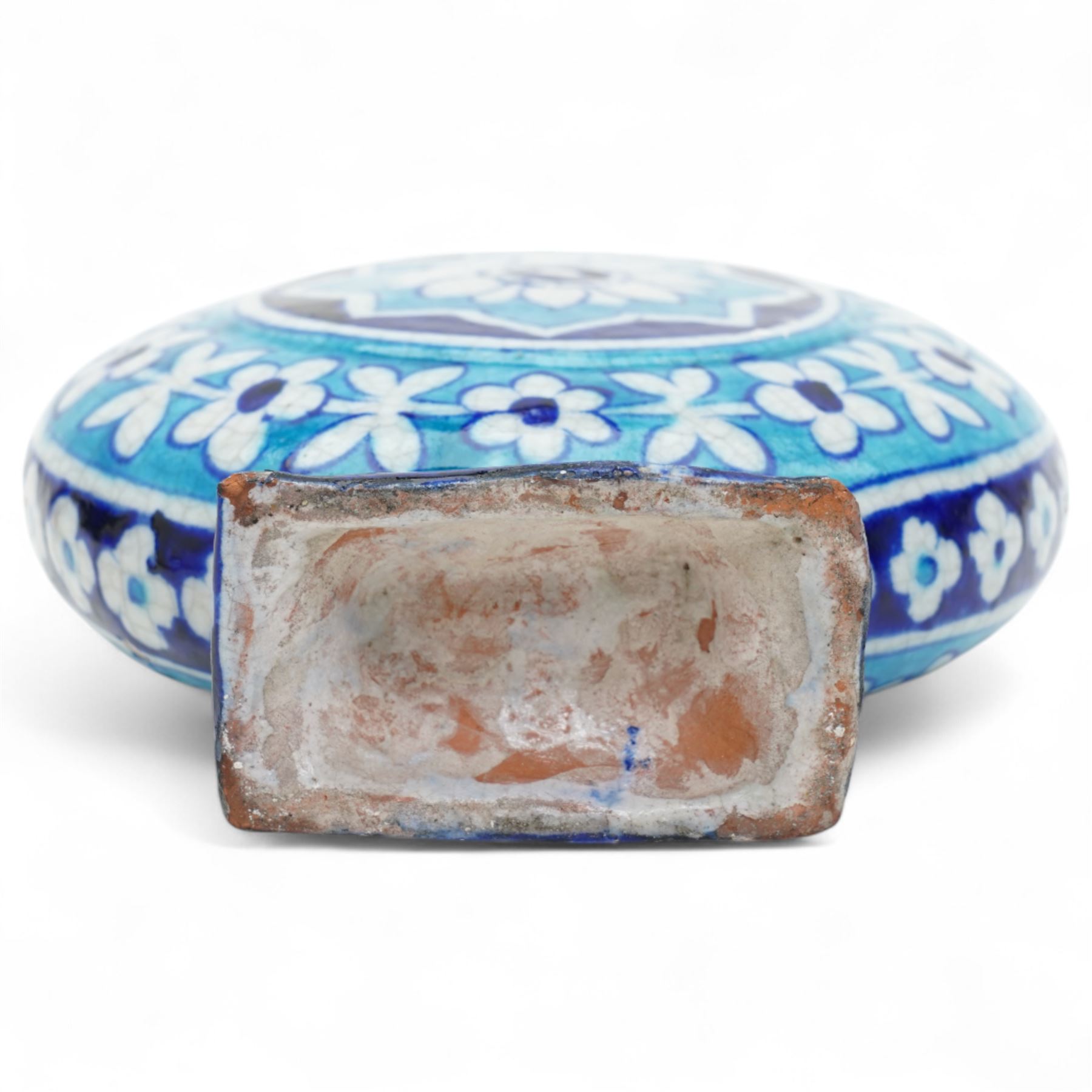 Indian 19th century Sind pottery moon flask, painted in colours of turquoise and cobalt blue, each side with lotus motif inside a border of flowers, H22.5cm