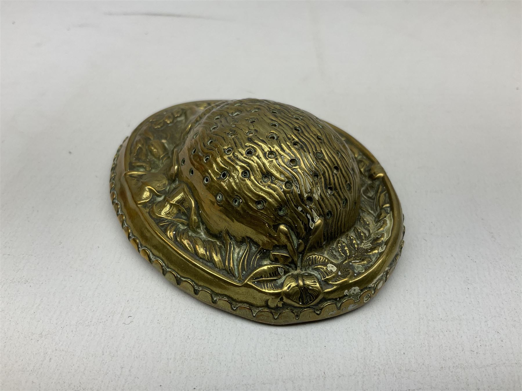 W Avery & Son brass oval pincushion in the form of a hedgehog, and horseshoe needle packet box both inscribed to base 'W. Avery and Son, Redditch', with registration mark, pin cushion L9cm 
