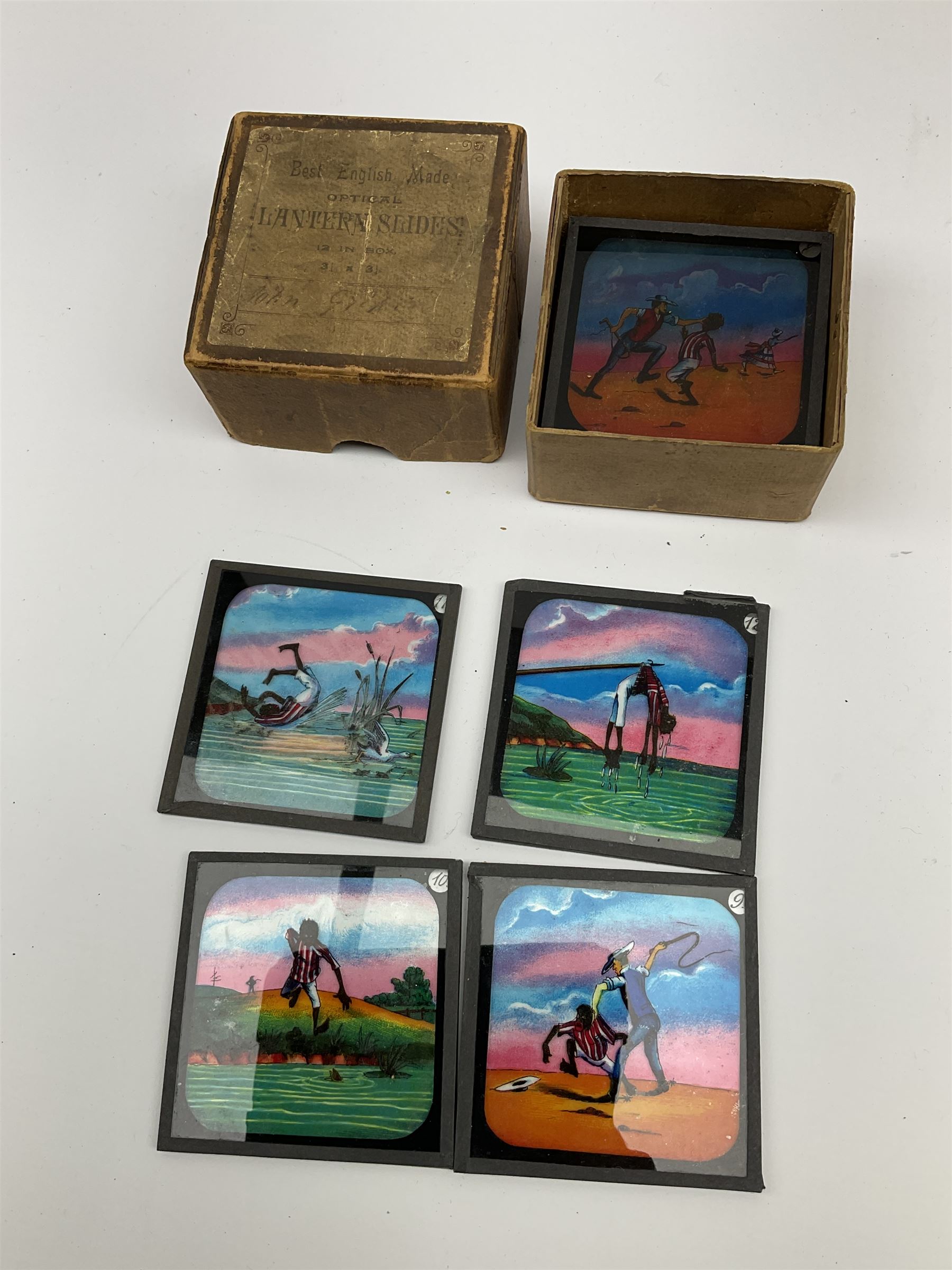 Set of twelve late 19th century magic lantern glass slides entitled 'A Negro's Life', together with forty-two further assorted late 19th/early 20th century magic lantern slides including Union Castle Line to South-East Africa by H.L. Toms London etc, housed in a wooden baize-lined box
