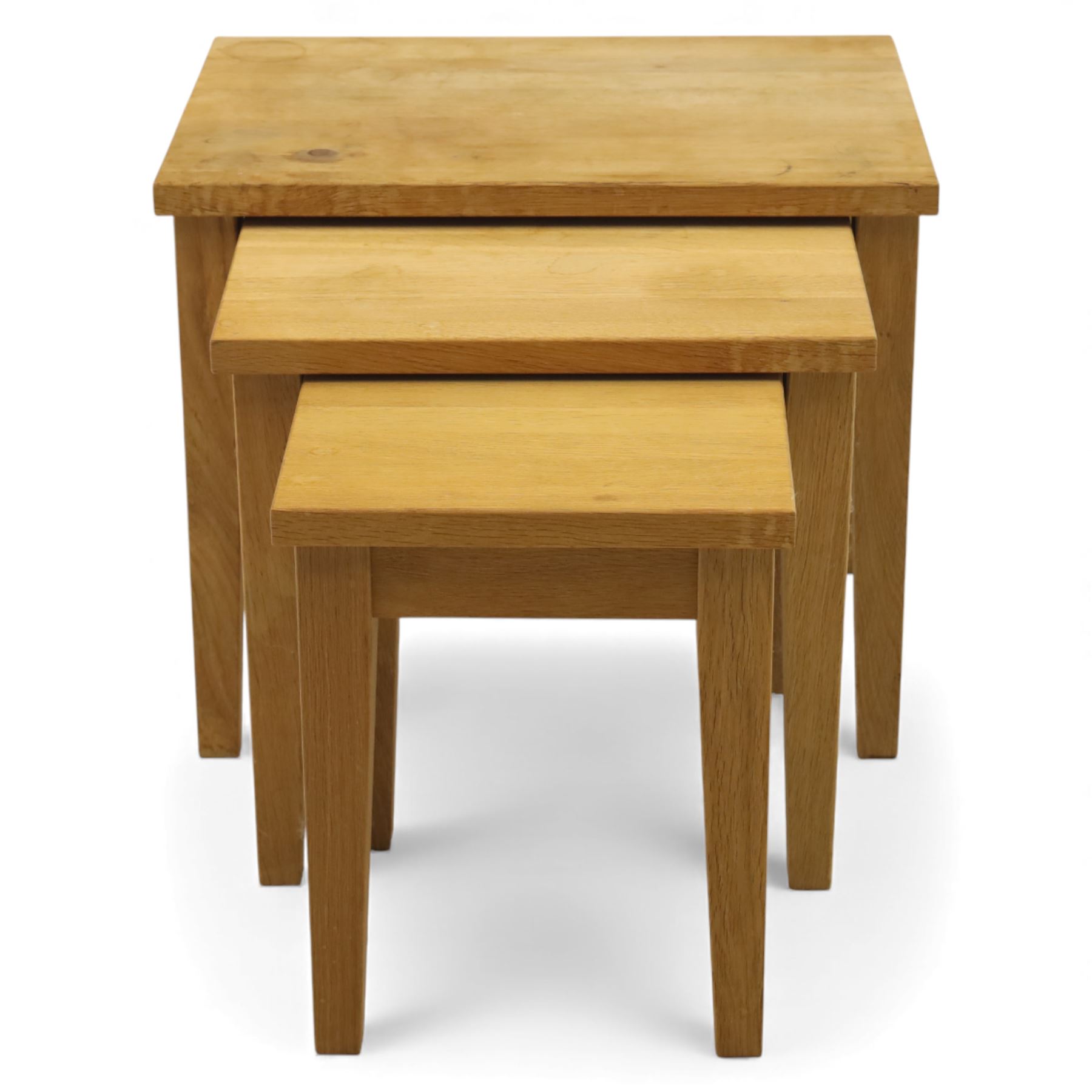 Modern solid oak nest of three tables, each with straight-edged rectangular top and square legs