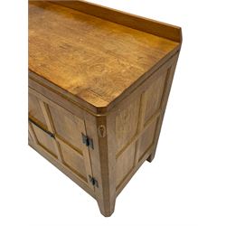 Rabbitman - adzed oak sideboard, fitted with three central drawer and two flanking cupboards, panelled doors with iron latches and hinges, carved with rabbit signature, by Peter Heap, Wetwang