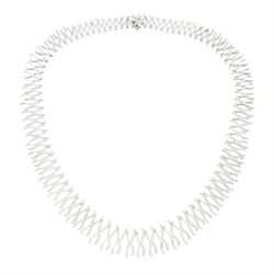 18ct white gold diamond fringe necklace, graduating fancy crossover links, thirty-three se...