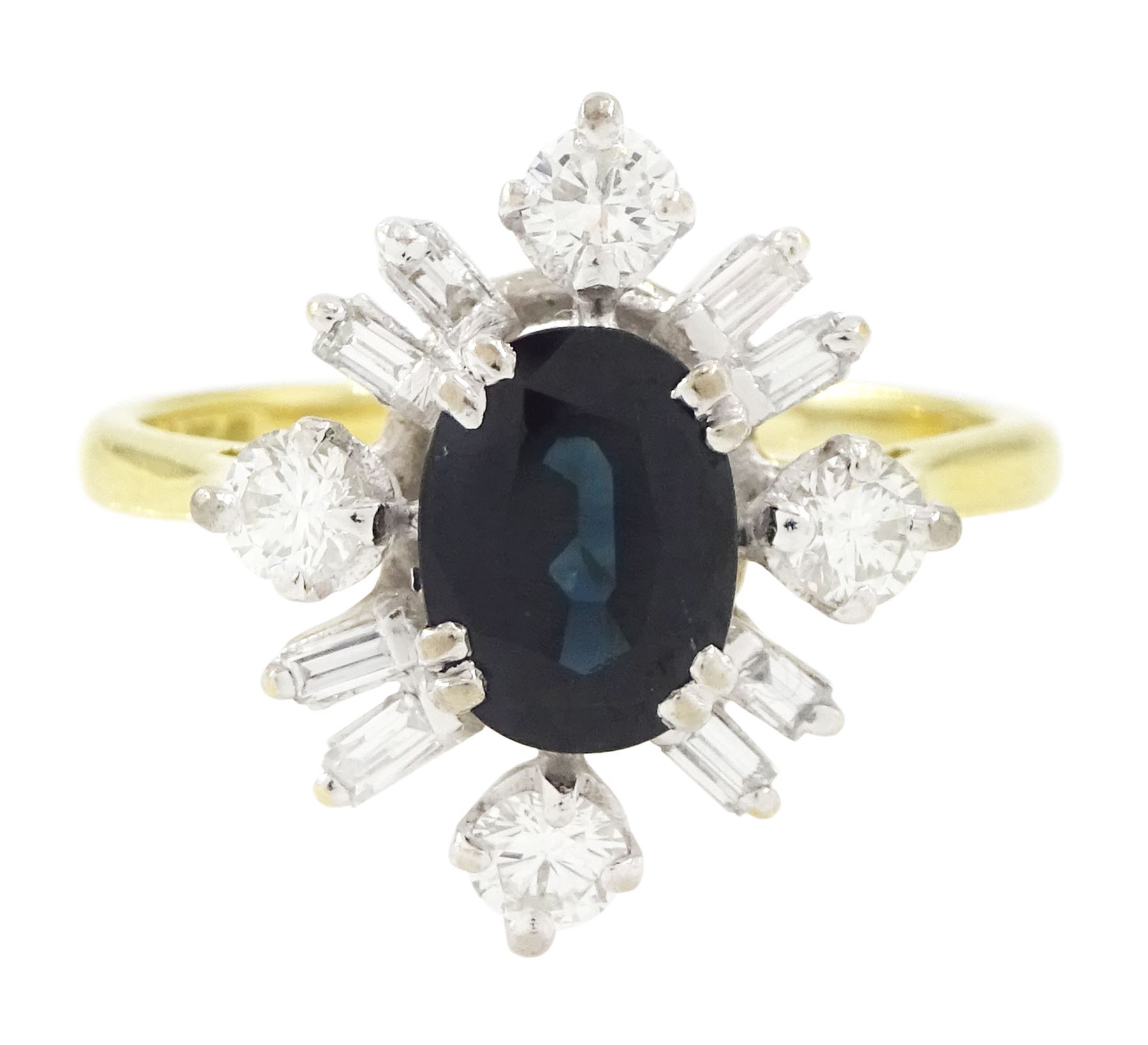 18ct gold sapphire and diamond cluster ring, single oval cut sapphire of approx 1.65 carat, surrounded by four round brilliant cut diamonds and eight baguette cut diamonds, London 1975, total diamond weight approx 0.60 carat