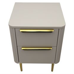 Made.com - 'Ebro' pair of grey bedside chests, gold painted metal shaped handles, rounded corners with fluted detail, raised on gold painted metal tapered supports