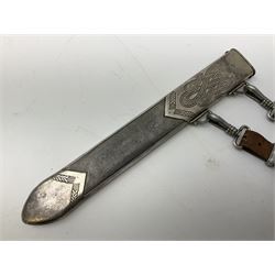 German Reichsarbeitdienst RAD Leader's Hewer dagger, the 26cm single edged scimitar shaped blade with narrow fuller, etched Arbeit adelt; by E.D. Wusthof, Solingen; the aluminium hilt with spade and wheat ear langet; two piece white plastic grip and eagle head pommel; pebbled steel scabbard engraved with ears of wheat and strapwork with double leather hangers L40cm overall