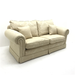Duresta two seat sofa upholstered in Ivory coloured fabric with floral pattern, scrolled arms, W205cm