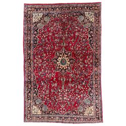 North West Persian Bidjar red ground carpet, shaped pole medallion surrounded by interlacing branches and stylised flower heads, five band border with repeating floral design