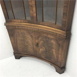 20th century figured mahogany double corner cabinet, dentil frieze above two doors enclosing two shelves above two cupboard doors, shaped bracket supports, W92cm, H189cm, D50cm