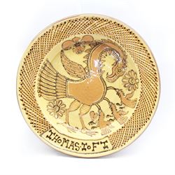 John Hudson: Large slipware charger in the style of Thomas Toft by John Hudson of Mirfield Pottery, decorated with a cockerel, incised marks verso, D 41cm.