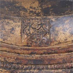 20th century bronzed buddha, with one hand raised, seated upon a lotus leaf, H27cm