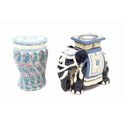 A Chinese garden seat, of baluster form with circular top, decorated with pink and blue stylised bands of flowers, H42cm, together with a blue and white plant stand modelled in the form of an Elephant, H43cm. 