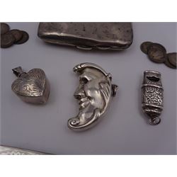 Group of novelty silver items, comprising man in the moon vesta case, perfume pendant and a whistle, unmarked but test silver, together with a mother of pearl handled silver fruit knife, silver cigarette case, both hallmarked and a small quantity of silver threepences