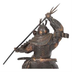 Japanese bronze of a Samurai, possibly Meiji period, standing holding a three pronged spear, on a wave form base, H67cm