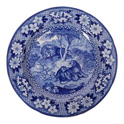 Early 19th Century Spode Caramanian series serving dish, printed in blue and white with the Triumphal Arch at Tripoli in Barbary, reserved within a running border of Indian sporting animals, together with Rogers Camel pattern platter and plate, Adams Lions plate and Davenport platter, largest platter L43cm 