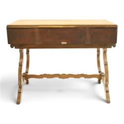 Leemings of Halifax (est. 1872) - Arts & Crafts oak side table, rectangular caddy top with raised moulded back, the frieze carved with central Yorkshire rose motif flanked by two drawers, raised on twin stylised lyre end supports formed of C-scrolls, united by shaped stretcher
