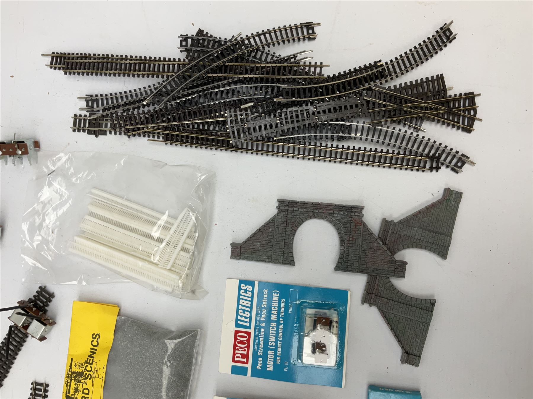 Peco 'N' gauge - quantity of track including motorised points, straights, curves etc; and quantity of packeted accessories including Motor(Switch Machines), nickel silver joiners etc