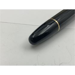 Montblanc Meisterstuck No. 146 fountain pen, the black plastic barrel and cap with gilt clip and banding, and 14ct white and yellow gold nib marked 4810 14K, together with Montblanc mystery black ink, both boxed, pen L14cm (2)
