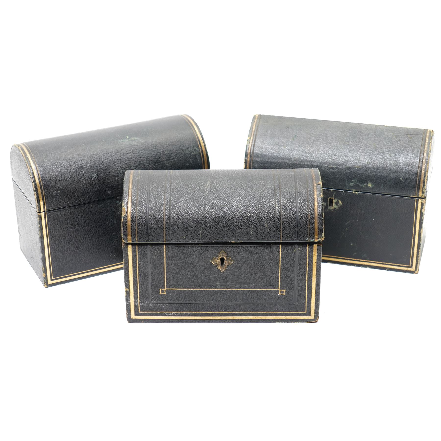 Victorian tooled leather dome top stationery casket by Parkins & Gotto, 24 & 25 Oxford St  with watered silk interior L21cm , another dome top casket and a lancet top casket (3) 
Provenance: property of a Nobleman