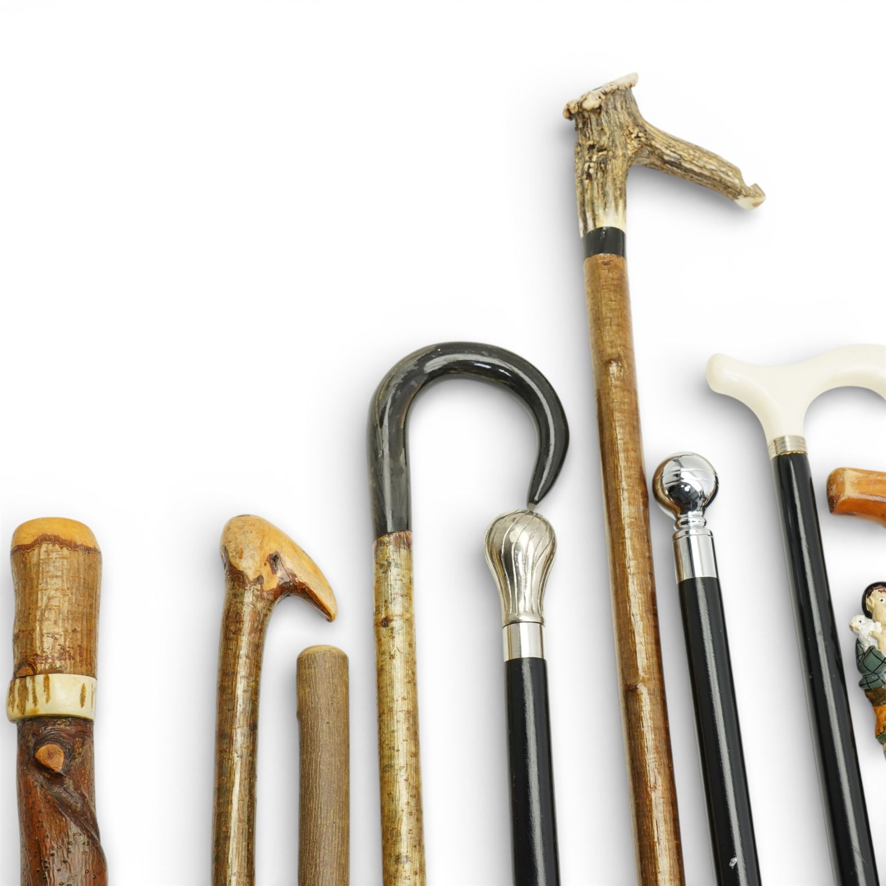Collection of modern walking sticks, ebonised evening canes, thumb stick and shooting stick etc 