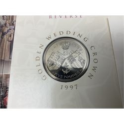 The Royal Mint United Kingdom 1984 brilliant uncirculated coin collection, 1997 and 2001 commemorative crown coins, 1997 old round one pound, all in card folders and four sterling silver medallic first day covers from the 'Great Britons' collection housed in a blue folder