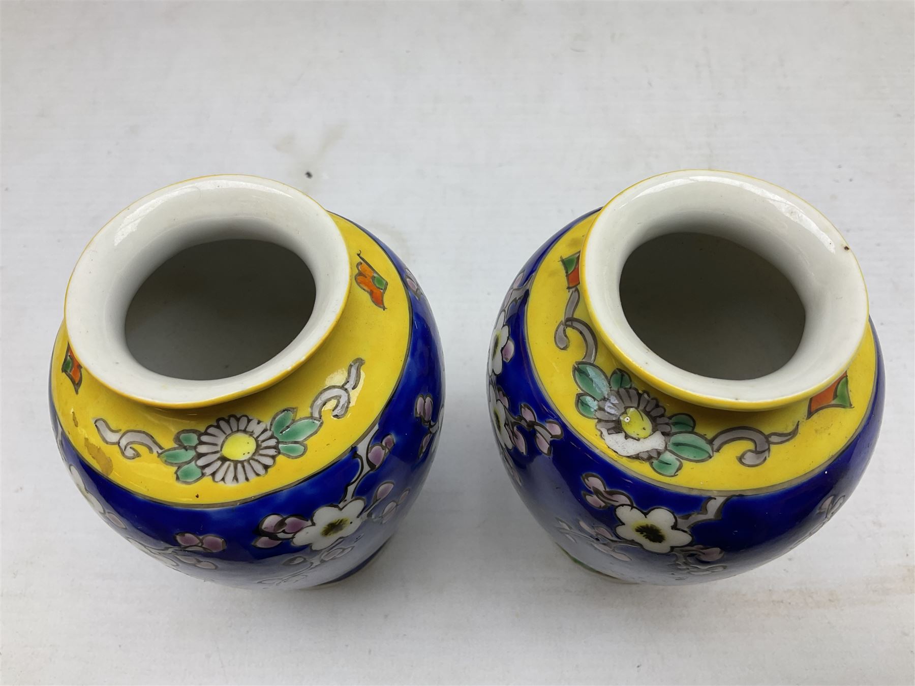 20th Century Japanese vase decorated with a blue dragon and gilding upon red yellow ground, bears Fukagawa Seiji mark (a/f), together with pair of blue cloisonné vases of baluster form decorated with blossom, and pair of Japanese vases, tallest H26cm