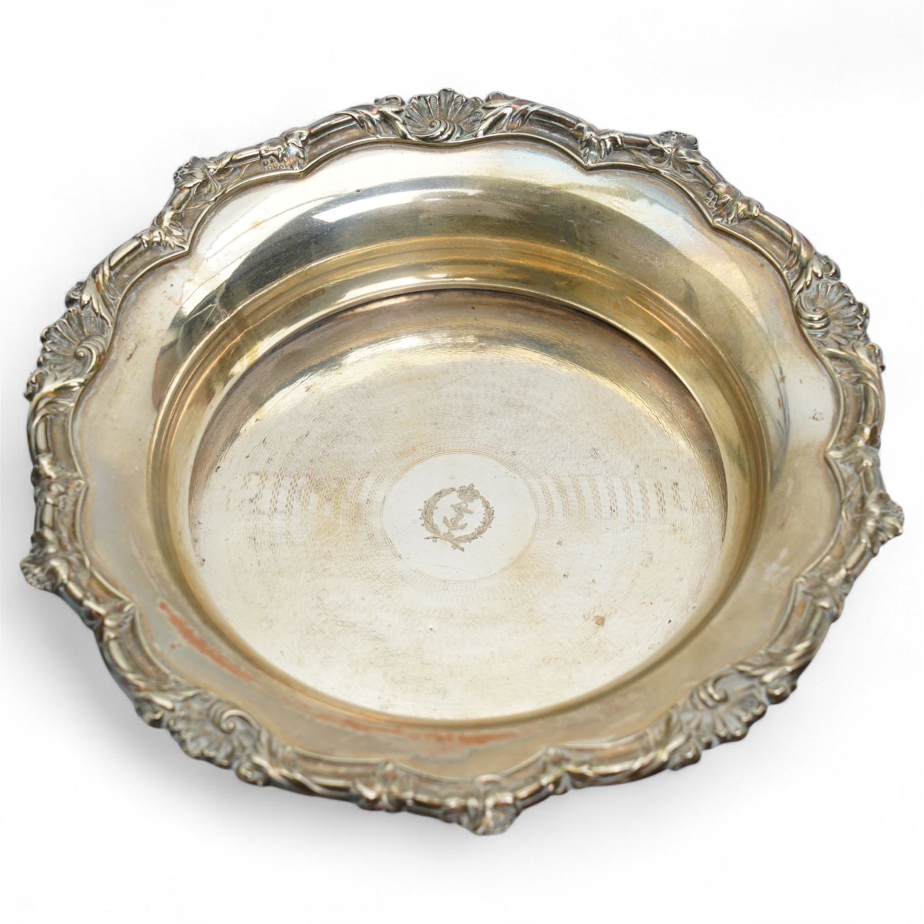 Early 19th century silver punch ladle, the bowl inset with a George III coin and with twisted whale bone handle,, plated wine funnel, two knives by John Wigfall, Sheffield with mammoth tooth handles, plated coaster with engraved crowned anchor crest, teapot stand with brass centre and plated surround and a pair of sugar tongs  