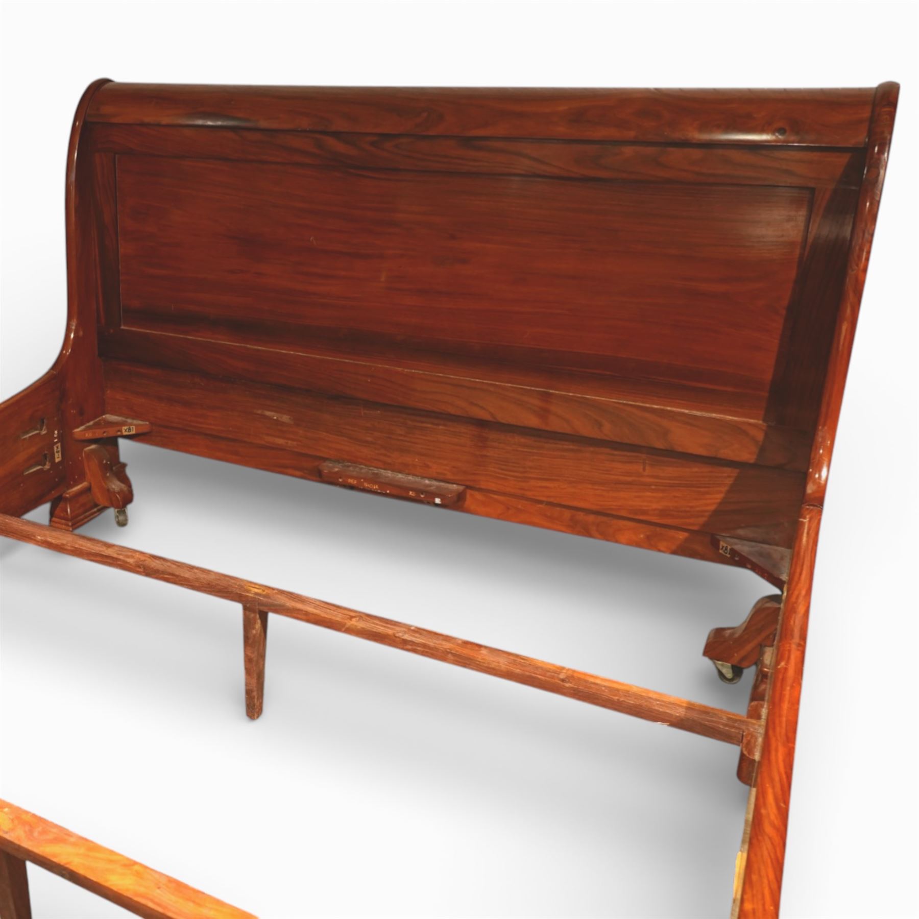 Victorian style mahogany super king sleigh bed with bases, shaped panelled headboard and footboard with scrolled ends, moulded side rails, raised on block supports with castors