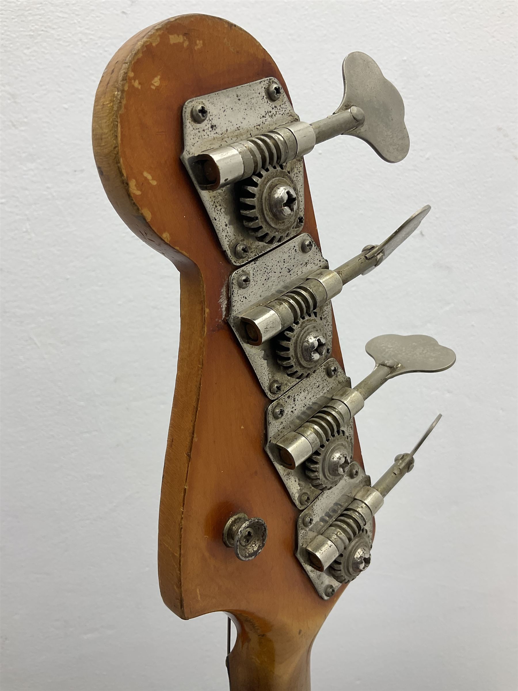 1963 Fender Jazz three-knob bass guitar; impressed with date code 7AUG63A on end of neck and serial no.L08587 on back plate; all original but re-finished in white in the 1970s; sold with photographs of the instrument in the 1960s with original finish and in the 1970s re-finished; L117.5cm; in original hard carrying case; Provenance: the professional guitar of Howard Livett from new to his death in 2005. Howard played in The Humperdincks, the backing group for Englebert Humperdinck, also played in the backing group for Max Bygraves and in the band Hedgehoppers Anonymous. The guitar is also sold with a manuscript letter of provenance from Howard's wife.