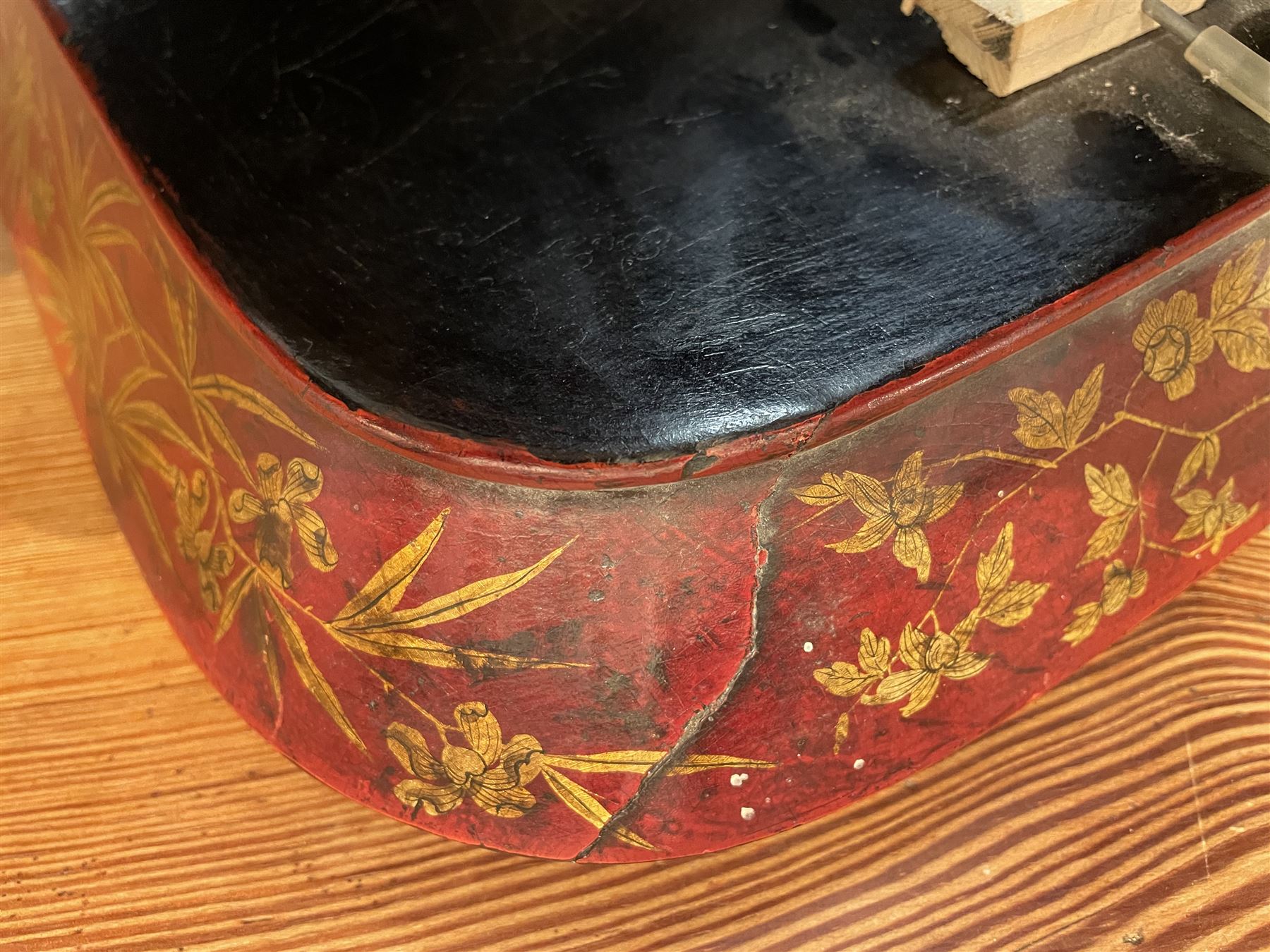Early 19th century red lacquered papier-mâché tray by Clay of King Street Covent Garden, of rounded rectangular form, painted in gilt with large foliate sprays and butterflies, impressed verso CLAY KING ST COVENT GARDEN, W66.5cm D48.5cm