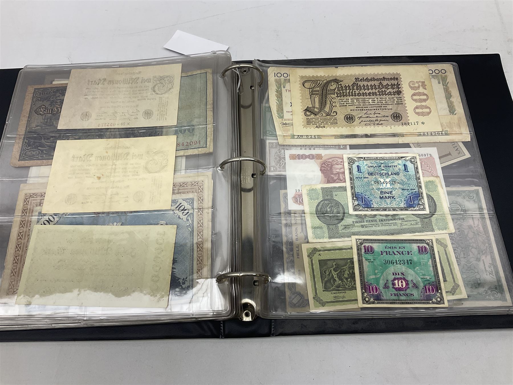 World banknotes, including Queen Elizabeth II The States of Jersey one pound 'DB202703', five pounds 'BB527762' and ten pounds 'AB651481', reserve bank of New Zealand two dollars '1L3 741894', King George V Straits Settlements one dollar 1st January 1935 'F/83 28924', various Bank of England notes etc, housed in two ring binder albums