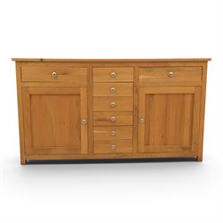 Solid oak sideboard fitted with drawers and cupboards, central bank of six drawers, metal pulls 