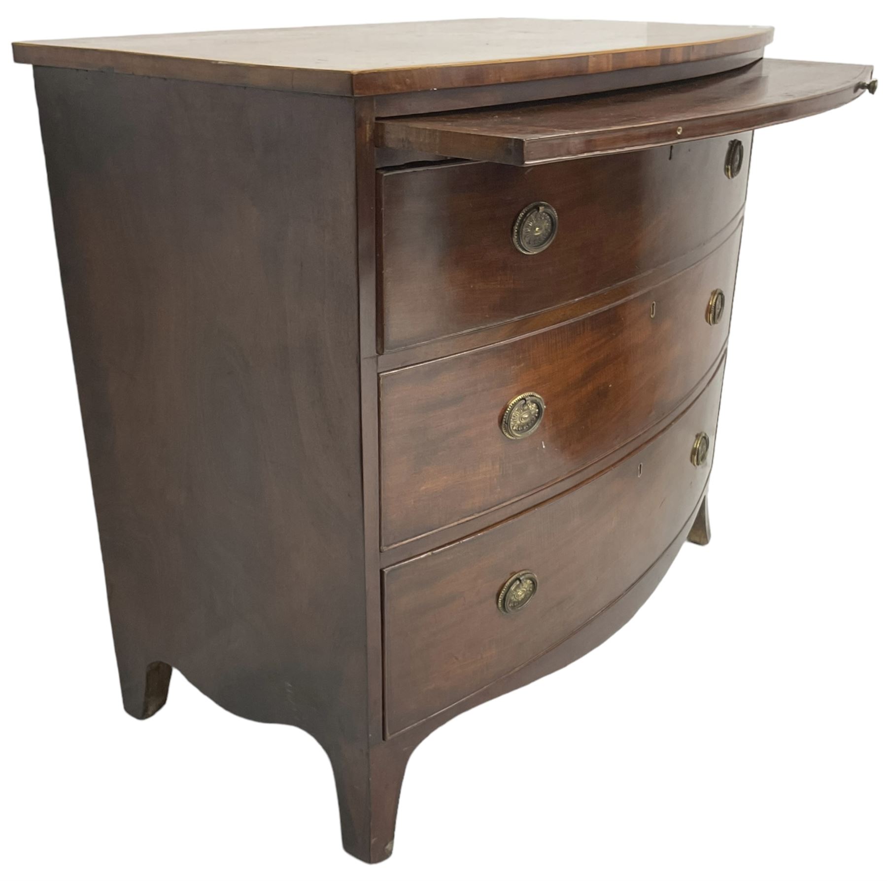 George III mahogany bow-front chest, shaped top with satinwood stringing, fitted with brushing slide over three graduating cock-beaded drawers, shaped apron over bracket feet