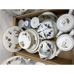 Royal Worcester Evesham pattern dinner and tea wares, comprising five dinner plates, three salad plates, one dessert plate, and twelve side plates, one bowl, tureen and cover, seven assorted serving dishes/platters, biscuit barrel and cover, three tea pots, coffee pot, six teacups, eleven saucers, two jugs, and an open sucrier, together with a selection of Royal Worcester June Garland pattern wares, comprising serving plate, stand, six tea cups and six saucers, six side plates, and open sucrier, and Royal Worcester Silver Chantilly pattern plates, etc. 
