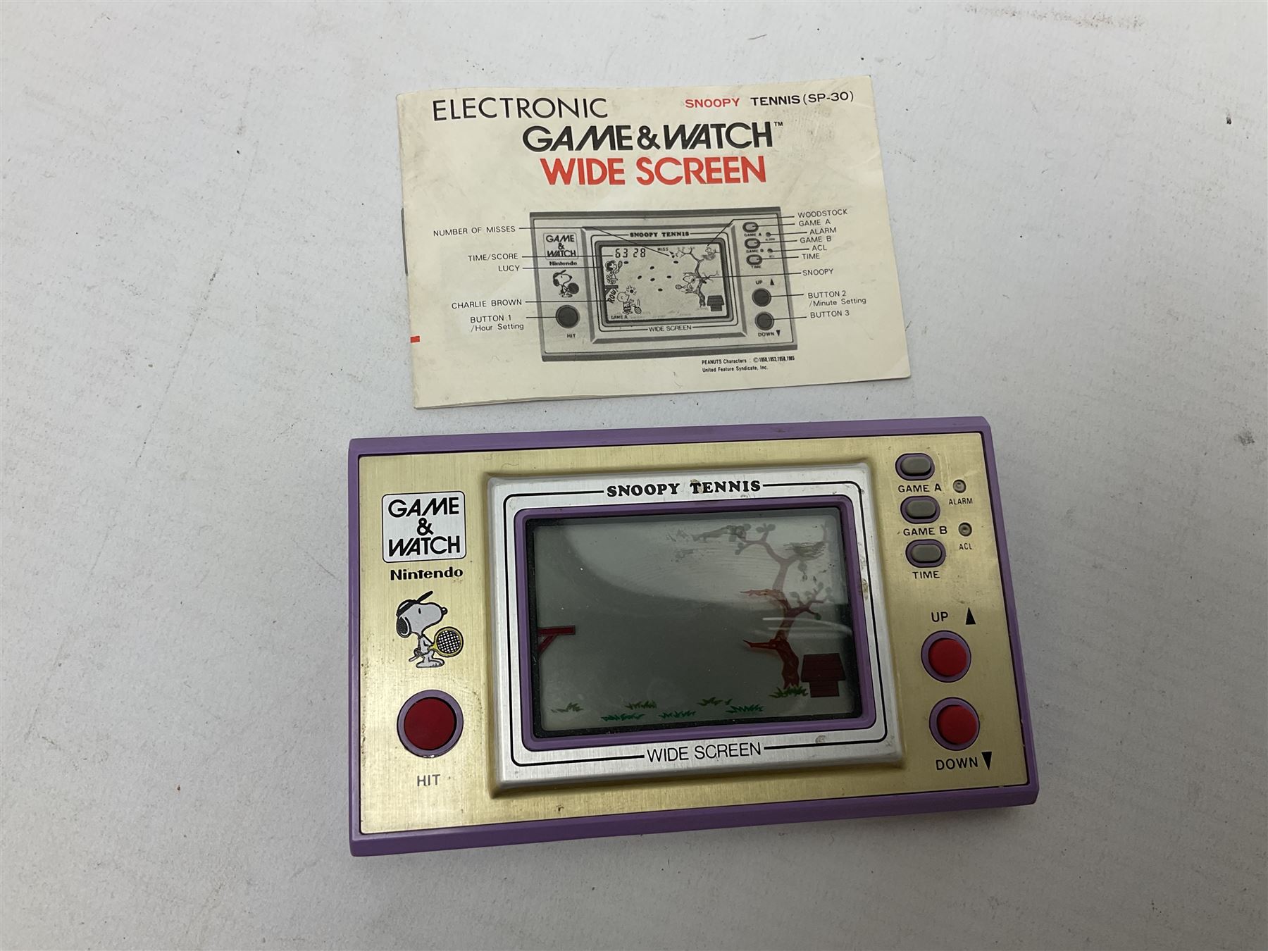 Collection of retro handheld games, including Nintendo Game & Watch ‘Snoopy Tennis’ (1982) and ‘Squish’ (1986) both with instruction booklets, Casio CG-600 ‘Star Invader’ with box, 3 in 1 LCD cartridge game including ‘Soccer’, ‘Invader’ and ‘Bomb Finder’ games, and two Grandstand ‘Pinball Wizard’ (1988) games, both with original boxes