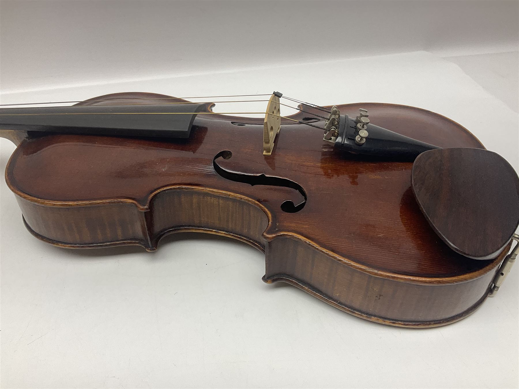 German trade violin in the Steiner style c1900 with 35.5cm two-piece maple back and ribs and spruce top L59cm overall; in fitted carrying case with two bows; and a Saxony violin with 35.5cm one-piece maple back and ribs and spruce top L58.5cm overall (2)