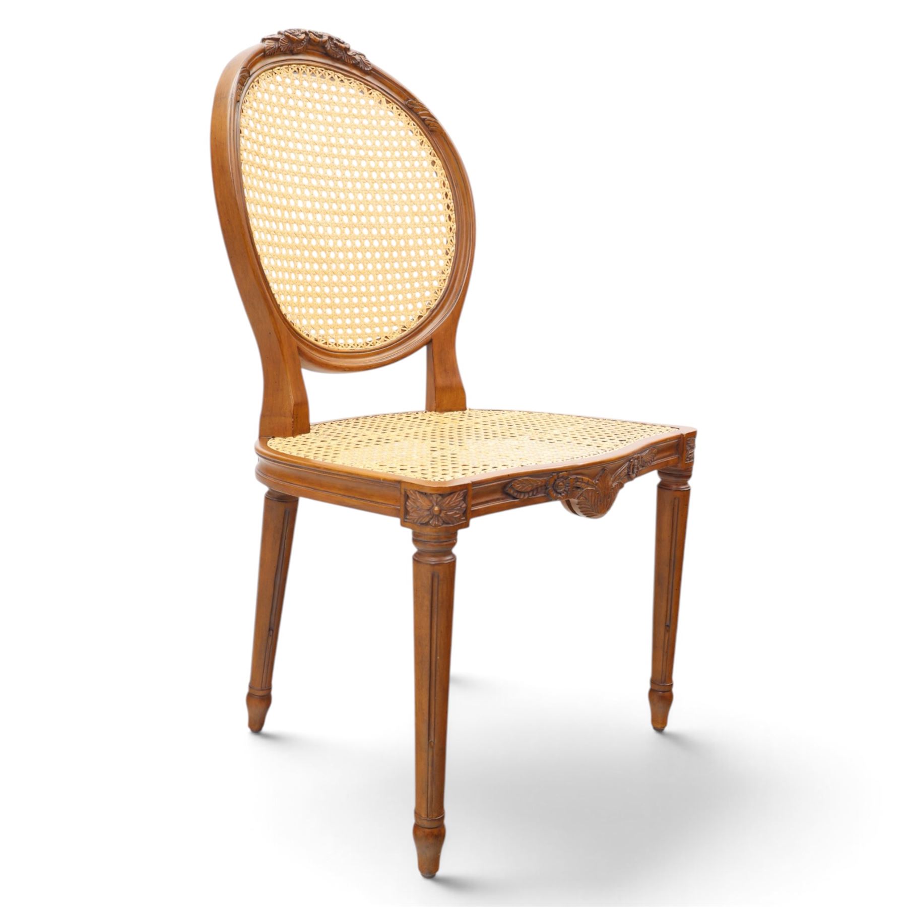 And So To Bed - French design 'Floral Caned Chair', balloon caned back with foliate carving, above a caned serpentine seat, reeded and turned supports