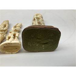 Three Japanese Tokyo School ivory figure, 19th century, comprising of man standing holding double gordes, man holding a flower with a basket on his head and a man with an adze and a basket with a frog in, tallest example H19cm, 