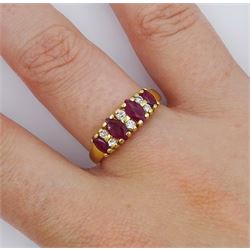 18ct gold marquise cut ruby and round brilliant cut diamond ring, stamped