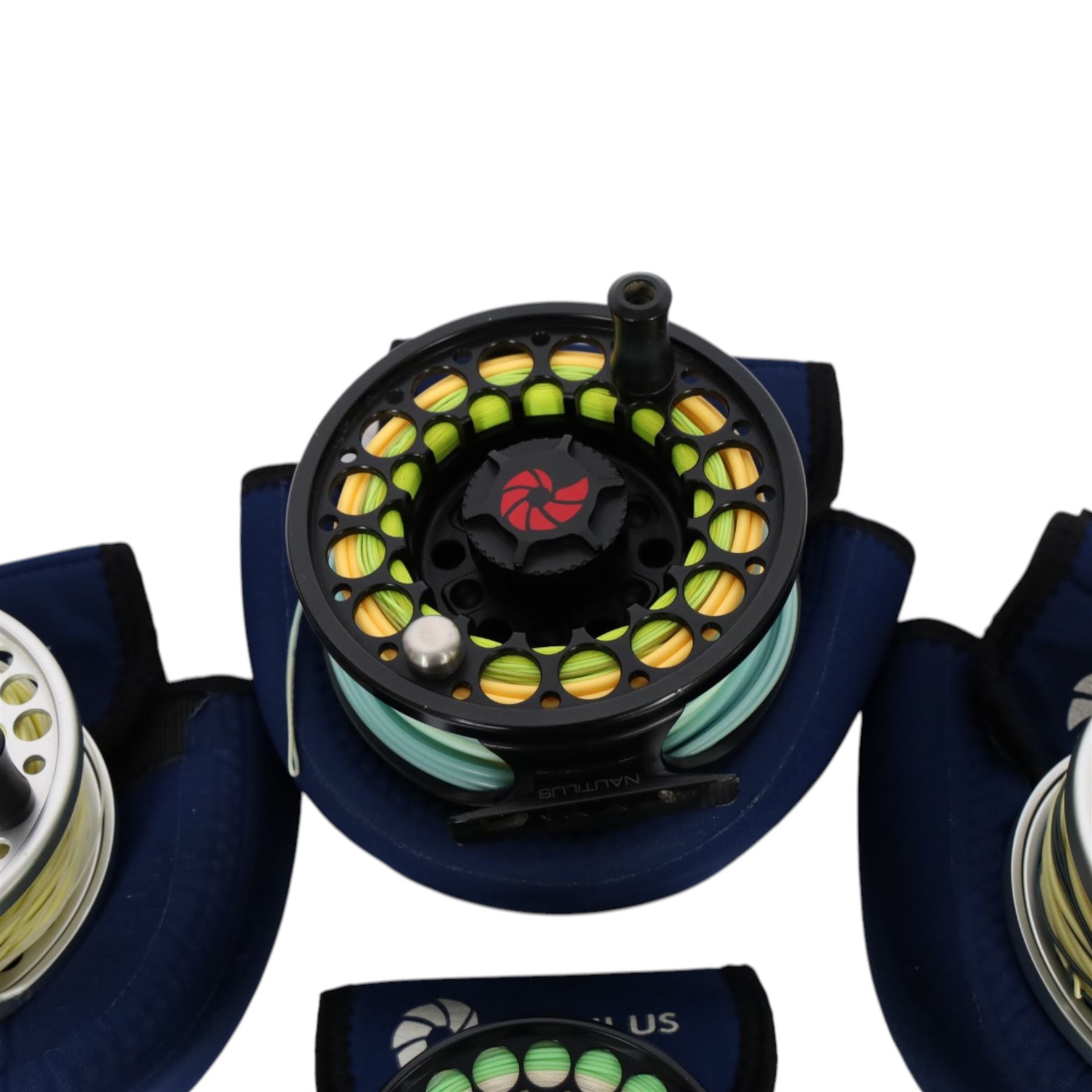 Four Nautilus USA fly reels, comprising T12, no. five and two no. ten models, all within Nautilus pouches
